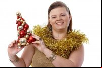 plump woman pics nyul christmas portrait happy plump woman holding small tree smiling photo